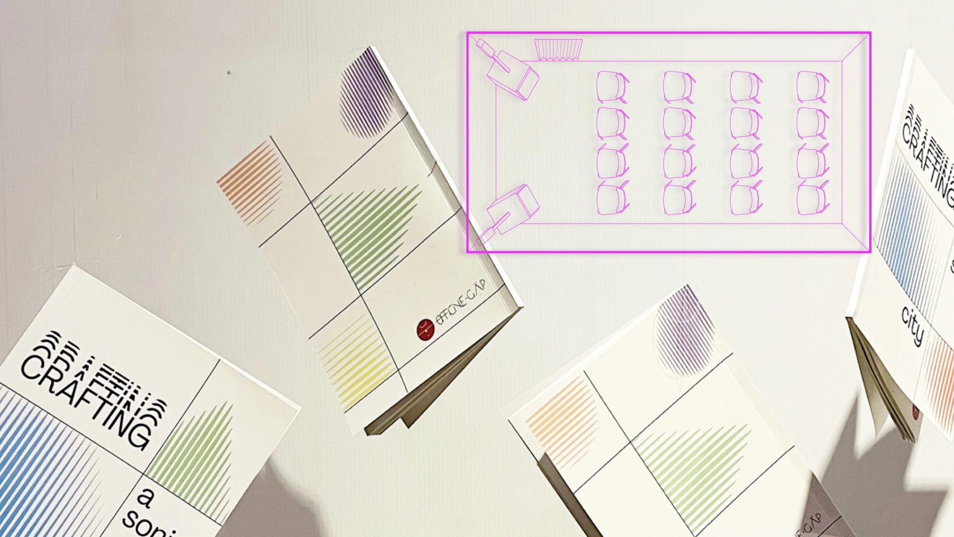 Crafting a Sonic City publications with a magenta plan of the listening room.